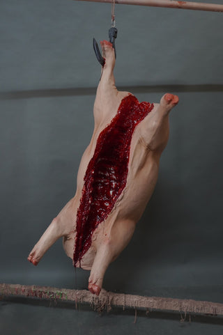 Headless Hanging Gutted Pig